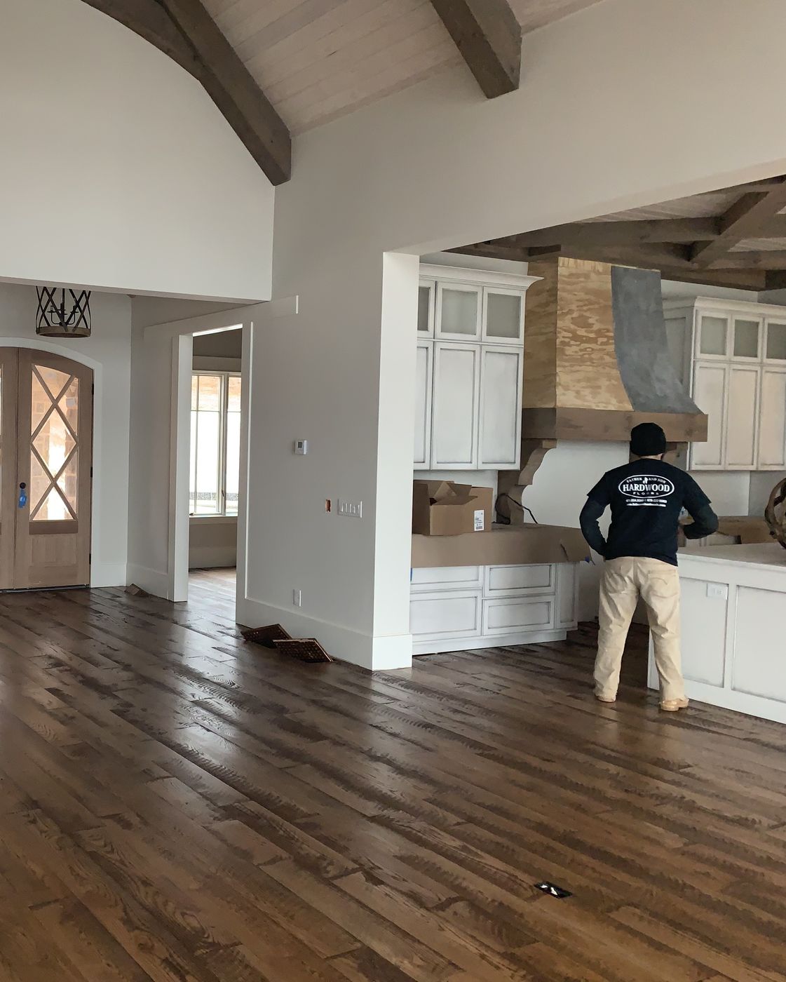 On the job, finishing a wide-plank oak floor